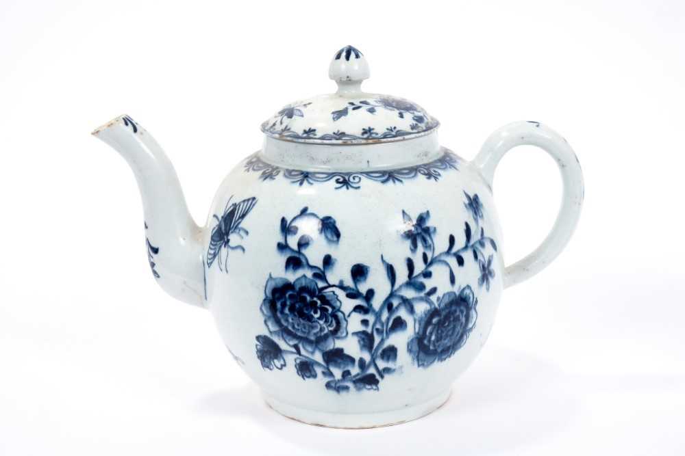 Lot 2 - Large Lowestoft teapot and cover, painted in blue with flowers and insects, painter's number 5 inside footrim, 17.5cm high Sold by Bonhams, 19 April 2011, lot 175