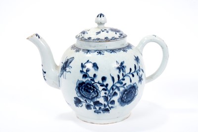 Lot 2 - Large Lowestoft teapot and cover, painted in blue with flowers and insects, painter's number 5 inside footrim, 17.5cm high Sold by Bonhams, 19 April 2011, lot 175