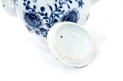 Lot 2 - Large Lowestoft teapot and cover, painted in blue with flowers and insects, painter's number 5 inside footrim, 17.5cm high Sold by Bonhams, 19 April 2011, lot 175