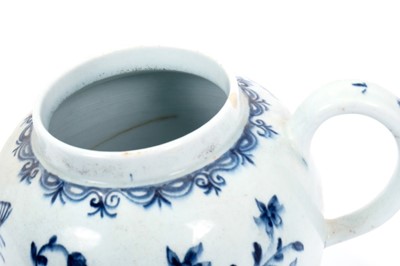 Lot 2 - Large Lowestoft teapot and cover, painted in blue with flowers and insects, painter's number 5 inside footrim, 17.5cm high Sold by Bonhams, 19 April 2011, lot 175