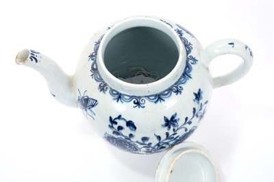 Lot 2 - Large Lowestoft teapot and cover, painted in blue with flowers and insects, painter's number 5 inside footrim, 17.5cm high Sold by Bonhams, 19 April 2011, lot 175