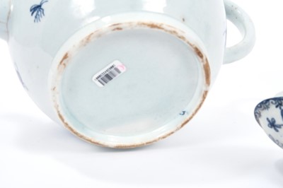 Lot 2 - Large Lowestoft teapot and cover, painted in blue with flowers and insects, painter's number 5 inside footrim, 17.5cm high Sold by Bonhams, 19 April 2011, lot 175