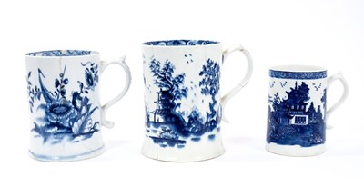 Lot 3 - Lowestoft cylindrical mug, with a spreading foot and scrolled handle, boldly painted in blue with flowers and leaves, a spring and an insect to reverse, a diaper and half floret border below the in...