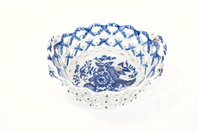 Lot 11 - Lowestoft basket, of smaller oval form, the latticework pierced sides applied with florets at the intersections, printed in blue with the Pinecone pattern, the interior with an elaborate painted bo...