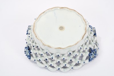 Lot 11 - Lowestoft basket, of smaller oval form, the latticework pierced sides applied with florets at the intersections, printed in blue with the Pinecone pattern, the interior with an elaborate painted bo...