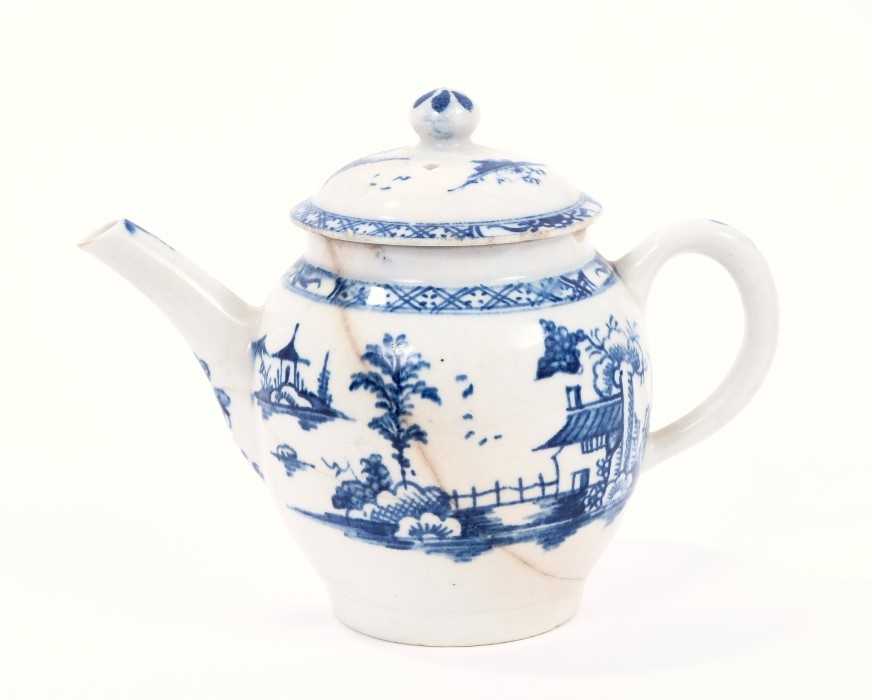 Lot 12 - Lowestoft teapot and cover, of globular form with a straight spout and button finial, painted in blue with a Chinese landscape, 10.7cm high