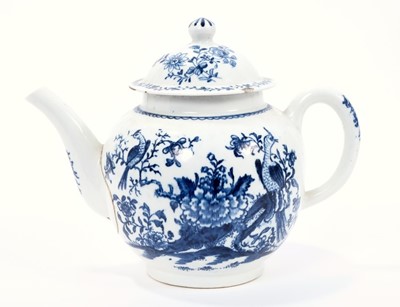 Lot 14 - Lowestoft teapot and cover, of globular form, printed in blue with a variant of the Birds in Branches pattern, within loop borders, 15cm high
