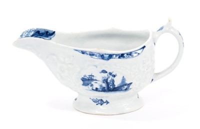 Lot 23 - Small Lowestoft sauceboat, moulded with panels edged with shells and flowering plants, painted in blue with a fisherman in Chinese river scenes, painter's number 3, 14cm long