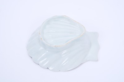 Lot 29 - Lowestoft pickle dish, of scallop shell form, painted in blue with a chrysanthemum within a scrolled border, 10.8cm long