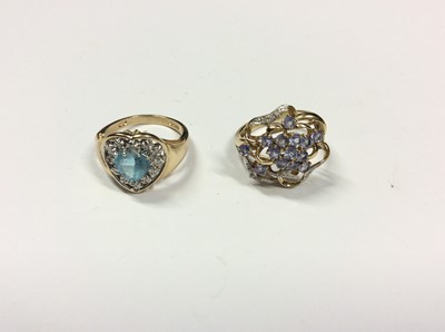 Lot 515 - 14ct gold heart shaped gem set dress ring and 9ct gold flower shaped gem set dress ring (2)