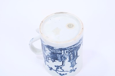 Lot 31 - Lowestoft mug, of small cylindrical form with a scrolled handle, printed in blue with a Chinese river landscape, a diaper border below the interior rim, 8.8cm high