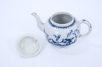 Lot 35 - Lowestoft teapot and cover, of globular form, painted in blue with a boy crossing a bridge within a berry border, the cover printed with Chinese islands, painter's number 3 inside footrim, 14.5cm h...
