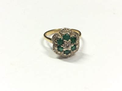 Lot 517 - 18ct gold emerald and diamond cluster ring. Size K½