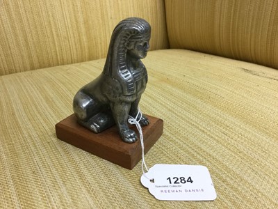 Lot 1284 - Armstrong - Siddley Sphinx mascot, mounted in wooden base, 10.5cm in overall height