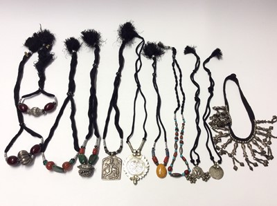 Lot 340 - Group of eleven Eastern white metal pendant and bead necklaces