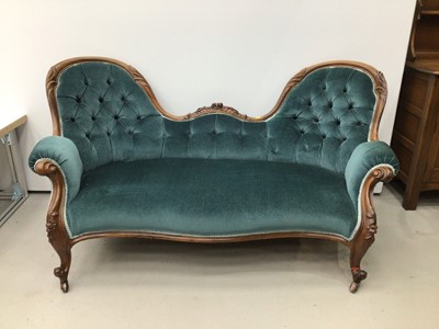 Lot 70 - Victorian double ended button upholstered sofa, with carved rosewood showwood frame and blue button upholstery on cabriole legs and castors
