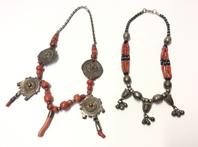 Lot 537 - Old Chinese coral bead necklace with four white metal enamelled disc pendants, and one other coral bead necklace with white metal bead decoration