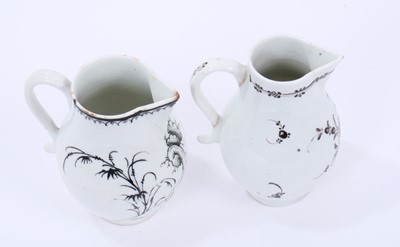 Lot 50 - Two Lowestoft sparrow beak jugs, the first strongly pencilled in black with a Question Mark rock beside a fence and flowering plants, highlighted in gold, loop and line border below rim