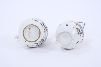Lot 50 - Two Lowestoft sparrow beak jugs, the first strongly pencilled in black with a Question Mark rock beside a fence and flowering plants, highlighted in gold, loop and line border below rim