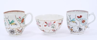 Lot 53 - Lowestoft coffee cup and tea bowl, painted with various insects and flower sprigs within gilded compartments, and a Worcester coffee cup of the same pattern (3)