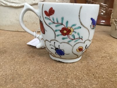 Lot 53 - Lowestoft coffee cup and tea bowl, painted with various insects and flower sprigs within gilded compartments, and a Worcester coffee cup of the same pattern (3)