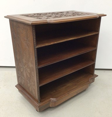 Lot 86 - Early 20th century Arts and Crafts carved oak open music cabinet