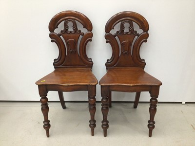 Lot 91 - Pair of early Victorian mahogany hall chairs