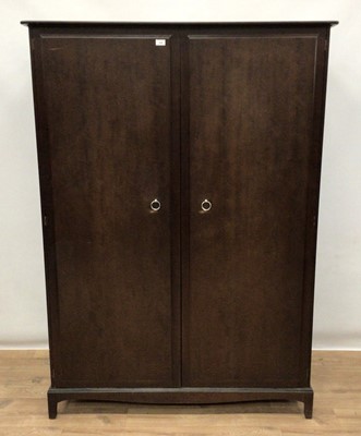 Lot 80 - Stag Minstrel bedroom suite comprising two double wardrobes, chest of three short and four long drawers, pair of single drawer bedside tables and a dressing table with triple mirror back and five d...