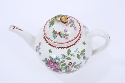 Lot 68 - Lowestoft teapot and cover, of globular form with a flower finial and curved spout, painted in Curtis style with flowers within a red line and loop border, 14cm high