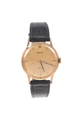 Lot 552 - A gentleman's 9ct gold vintage Rolex wristwatch with circular dial and baton numbers, the back of the case numbered 433230, on black leather strap with Rolex buckle