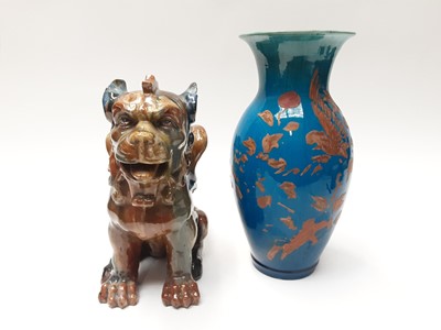 Lot 228 - Unusual Victorian glazed pottery model of a dragon, 27cm high and a blue glazed vase (2)