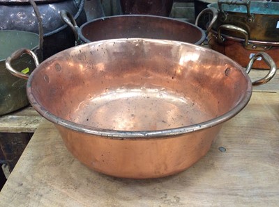 Lot 87 - Two large antique copper preserve pans together with a copper coal bucket (3)