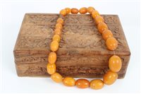 Lot 3384 - Vintage amber necklace consisting of a string...