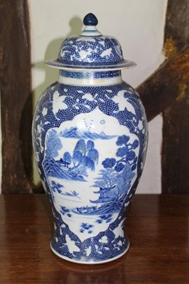Lot 1524 - 18th century Chinese porcelain blue and white vase and cover, of baluster form, with landscape reserves on relief moulded, signs this has been previously converted into a lamp
