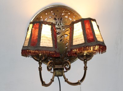 Lot 144 - Pair of brass twin branch wall lights, each with domed panel, formed from warming pan covers