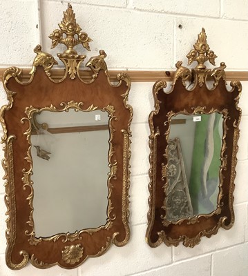 Lot 1543 - Near pair of Georgian style mahogany and parcel gilt wall mirrors
