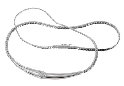 Lot 501 - Contemporary 18ct white gold and diamond single stone necklace with a single brilliant cut diamond estimated to weight approximately 0.16cts in a cross-over design with cable link polished white go...