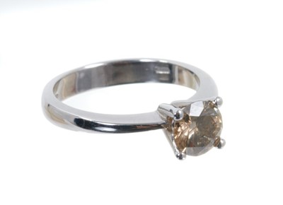 Lot 504 - Cinnamon diamond single stone ring with a round brilliant cut diamond estimated to weigh approximately 1ct in four claw 18ct white gold setting, Sheffield 2008.