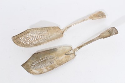 Lot 419 - George III silver fiddle pattern fish server with pierced and engraved decoration, (London 1815), maker William Bateman, together with another similar (London 1790), all at 11oz (2)
