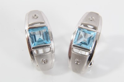 Lot 505 - Pair of contemporary diamond and blue topaz earrings in 9ct white gold setting with brushed and polished finish