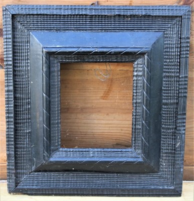 Lot 1790 - An antique, possibly 17th century, Dutch ripple mounded ebonised picture frame, to house a picture 25cm x 21cm