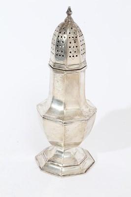 Lot 411 - George V silver sugar caster of faceted octagonal form with pierced slip in cover, on octagonal foot, (Sheffield 1936), maker Harrods Ltd,10oz, 22cm in height