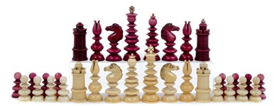 Lot 829 - Early 19th century, unsigned “Calvert” white and cerise stained ivory chess set, with turned pieces on domed bases, some minor losses, one pawn repaired. King 41/2 inches overall height.
