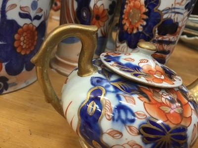 Lot 670 - Early 19th century Masons Ironstone Imari wares, including a twin handled vase, dessert tureen, mug, smaller vase, two spill vases and a miniature teapot, various marks, the large vase unmarked and...