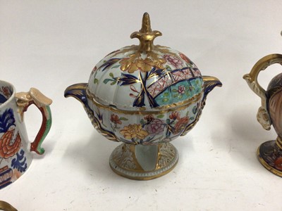 Lot 670 - Early 19th century Masons Ironstone Imari wares, including a twin handled vase, dessert tureen, mug, smaller vase, two spill vases and a miniature teapot, various marks, the large vase unmarked and...