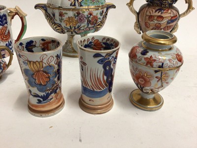Lot 670 - Early 19th century Masons Ironstone Imari wares, including a twin handled vase, dessert tureen, mug, smaller vase, two spill vases and a miniature teapot, various marks, the large vase unmarked and...