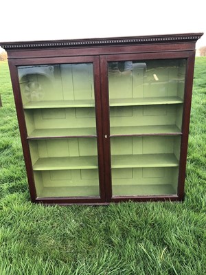 Lot 29 - Georgian mahogany bookcase with dentil cornice, twin glazed doors enclosing adjustable shelves with green painted interior, 124cm wide x 119cm high x 30cm deep