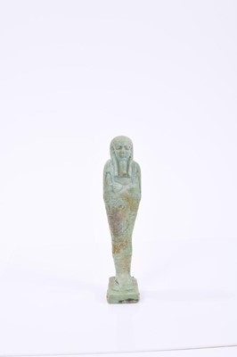 Lot 793 - Ancient Egyptian green faience shabti of mummiform with inscriptions 16cm high