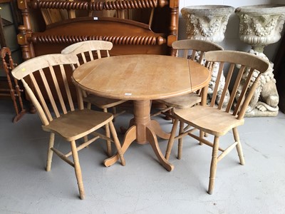 Lot 66 - Beech drop leaf kitchen table together with a set of four pine stick back chairs