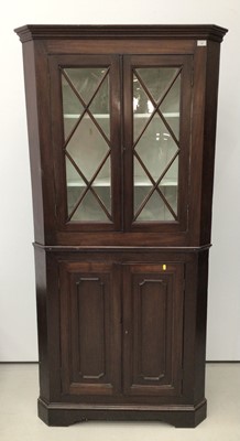Lot 37 - 19th century mahogany two height corner cupboard, the upper glazed section enclosing shelves, above twin panelled doors, 200cm high x 97cm wide